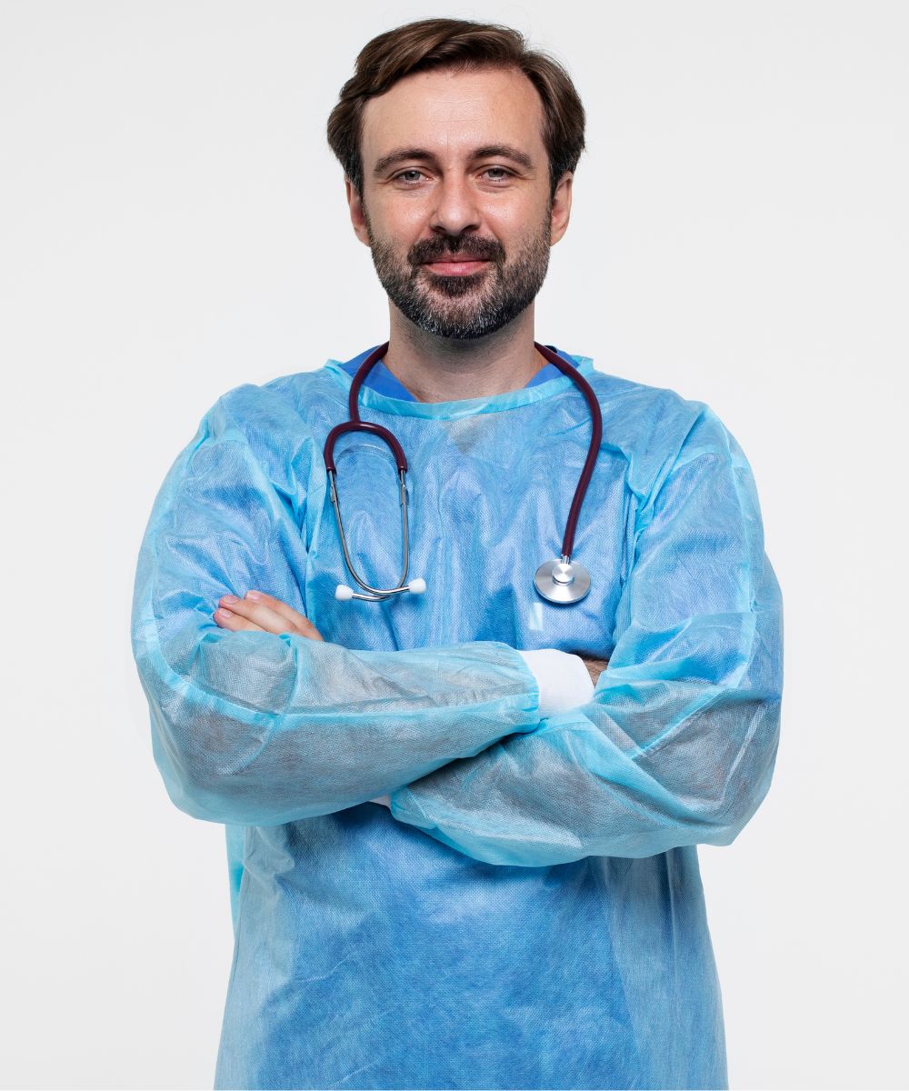 A person waering blue disposable surgical gown and stetoscope in his neck