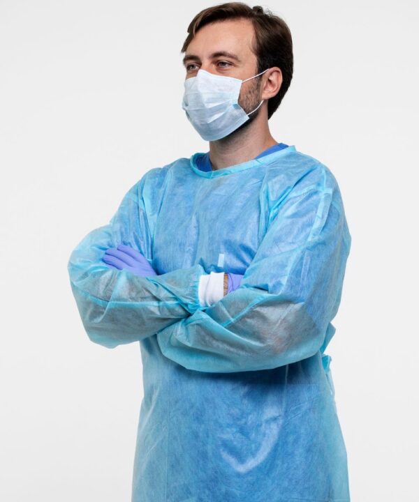 A person showing blue single use surgical gown